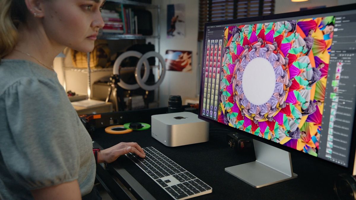 A user works on the Mac Studio Display.