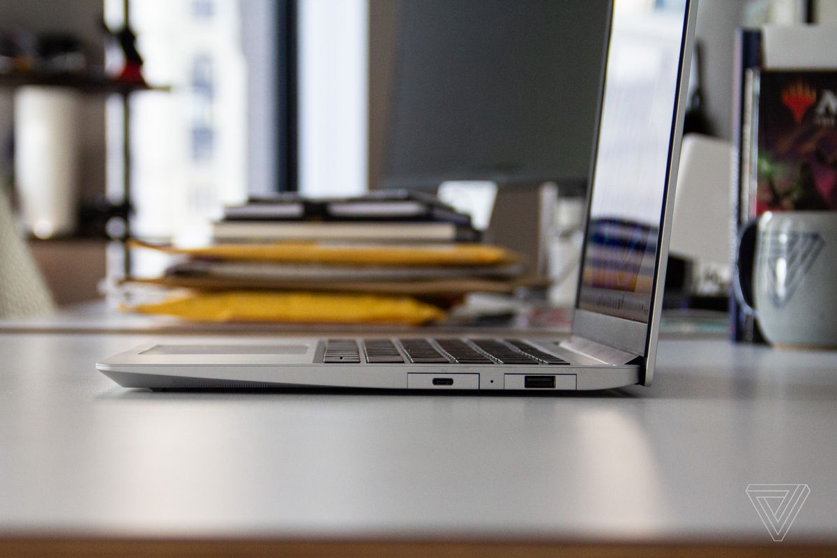 The right side of the Framework laptop with an office setting in the background.