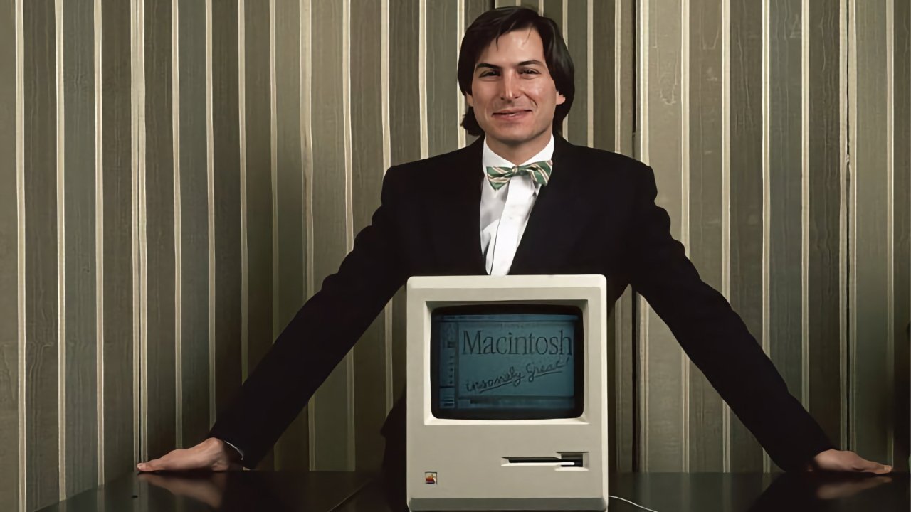 Steve Jobs with the original Mac