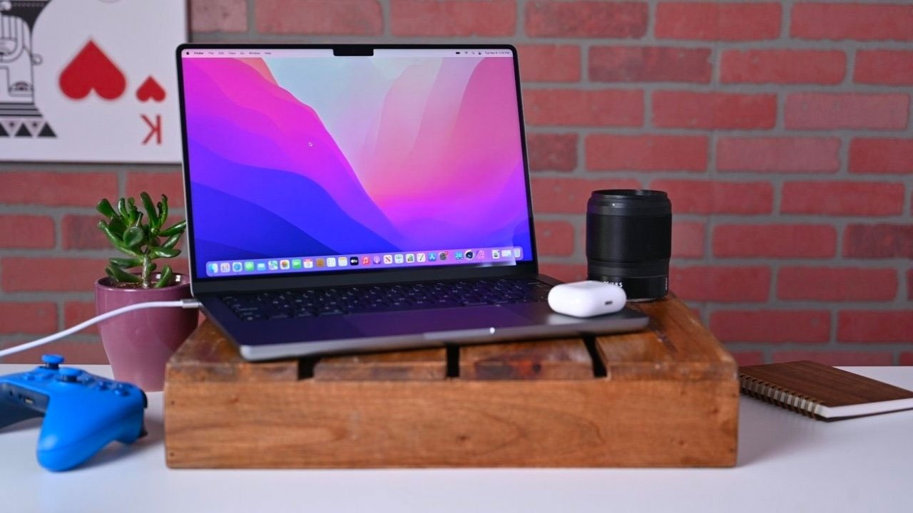 14-inch MacBook Pro on desk stand