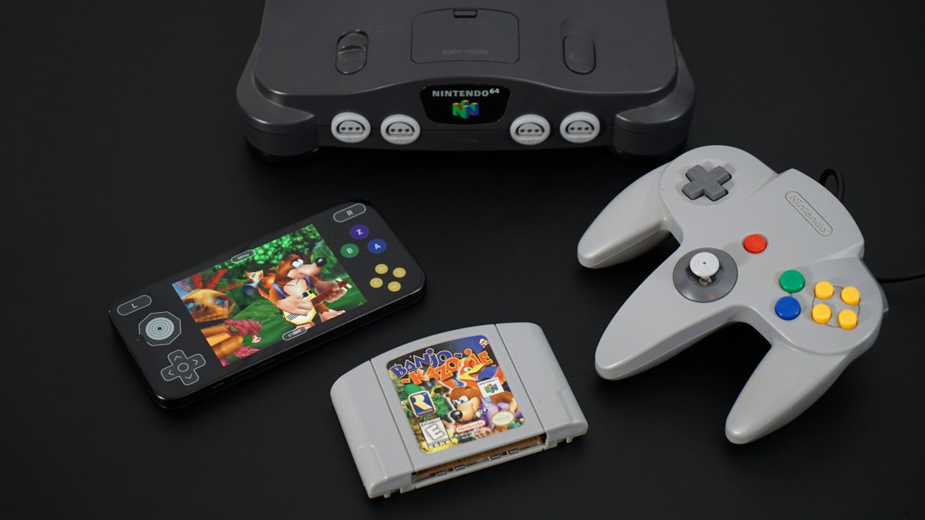 An iPhone with a scene from 'Banjo Kazooie' next to a Nintendo 64, controller, and game cartridge