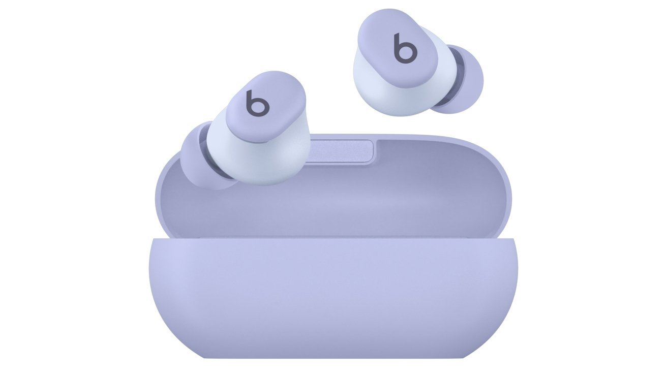 Purple wireless earbuds in an open charging case with a 'b' logo on each earbud.