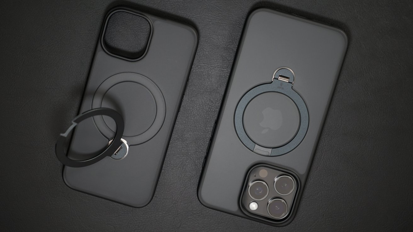 Two Torras iPhone cases laying on a black leather surface, one has the ring opened up