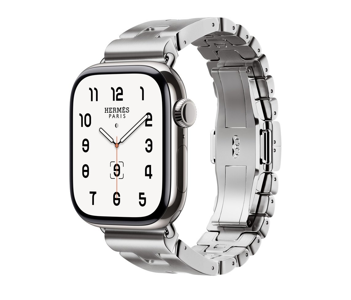 Silver luxury smartwatch with a metallic link band, featuring a square face and black numerals on a white background.